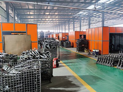 a factory floor showing the control arm manufacturing process