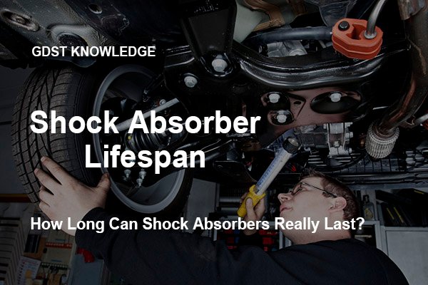 mechanic is checking the shock absorbers of a modern car