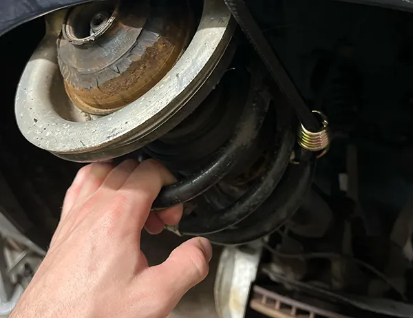 Strut Mount Inspection Inspecting suspension components to diagnose strut mount noise