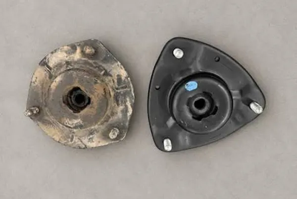 Old vs New Strut Mount Comparison Old and new strut mount comparison before installation